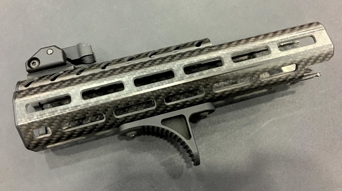 The new MPX rail is M-Lock all around with attachment slots at the 3, 6, 9, and 12 o'clock positions.