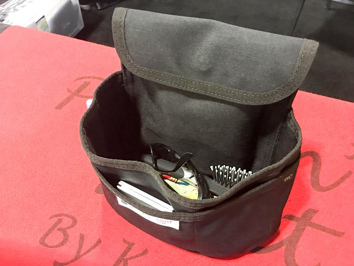 The Packin Neat purse insert. The tall pocket holds the gun in upright position for one-handed draw capability.