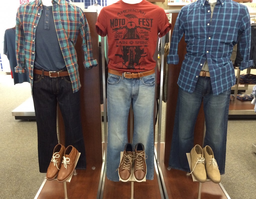 The merchandiser puts complimentary products together to make it easier for customers to buy related sets of product. Note how the center mannequin uses color to create a focal point.